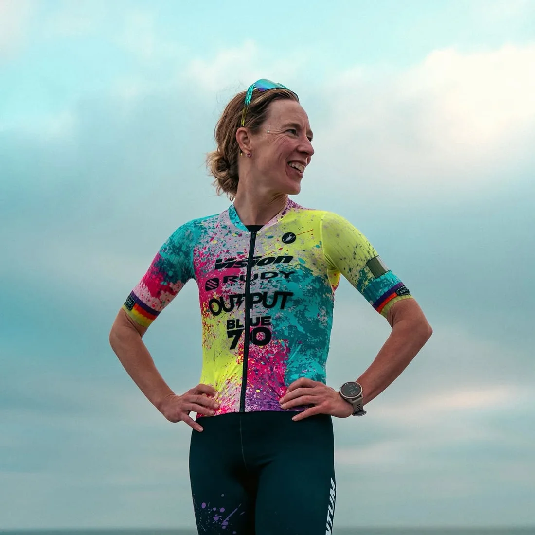 Fiona Moriarty smiling in her race kit by the sea