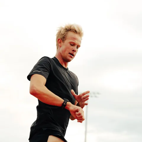 Joshua Berles checking his watch during a track session