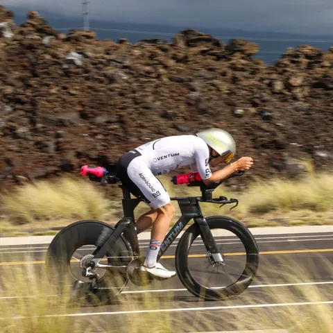 Kieran Lindars racing his Ventum time trial bike past lava fields