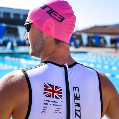 Kieran Lindars poolside in a Zone3 swimskin printed with his 2026 British record splits