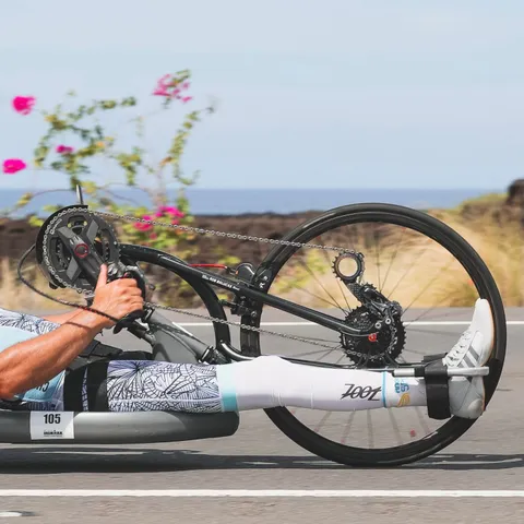 Rob Balucas on his handcycle beside the ocean